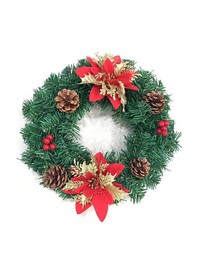 Christmas wreath with poinsettia, pinecones and red berries